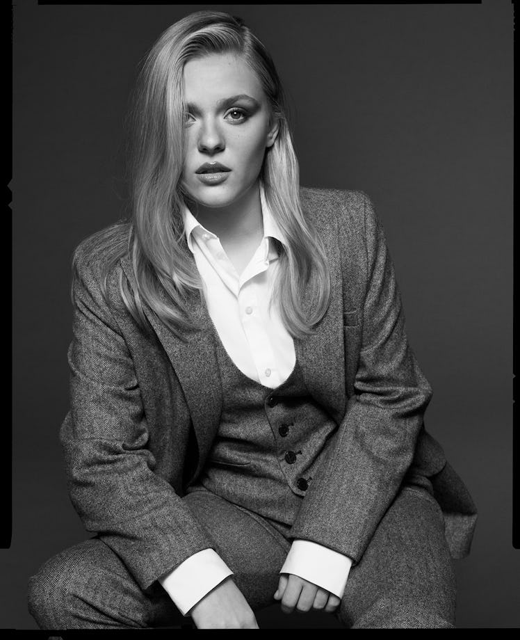 Maisy Stella wears a Dior jacket, vest, shirt, and pants.