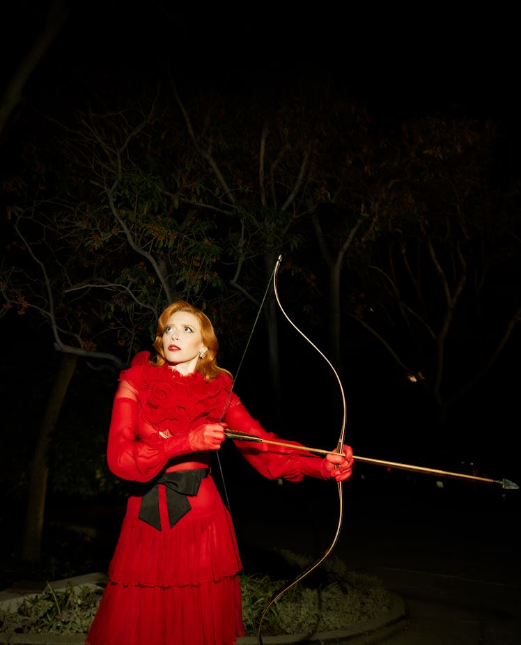 Lyonne wears a Valentino dress and scarf; Valentino Garavani earrings and gloves.