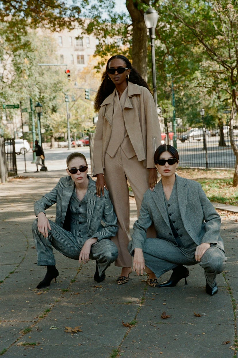 Three models pose in a Brooklyn park
