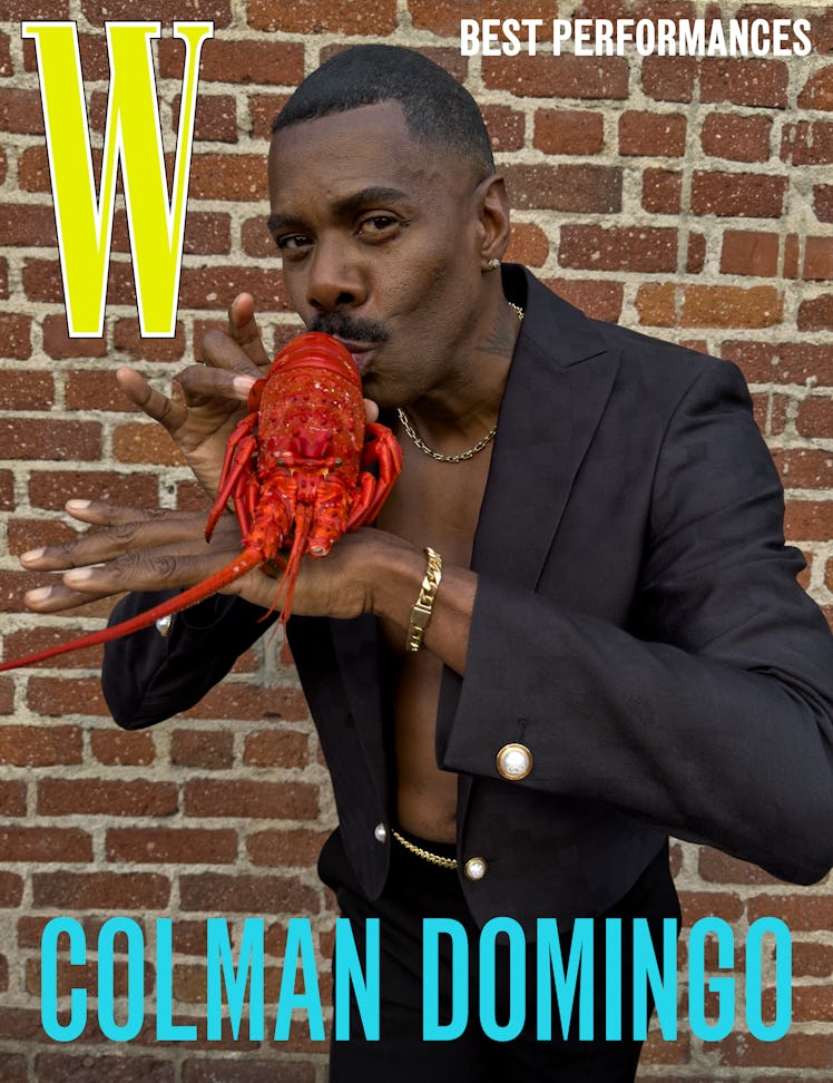 Domingo wears a Louis Vuitton Men’s jacket and pants; Tiffany & Co. necklace and bracelet; his own e...