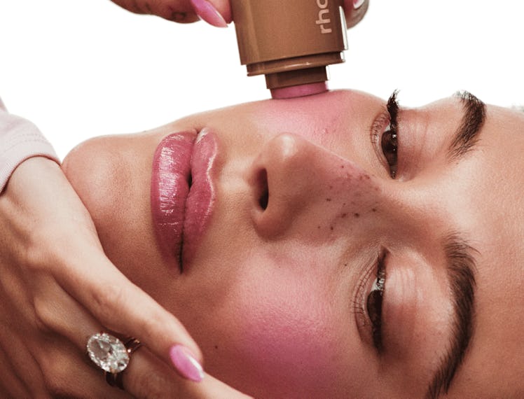 Hailey Bieber applies the Pocket Blush