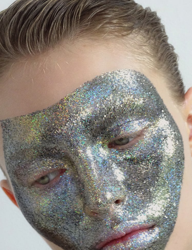 picture of a blonde person with glitter all over their face