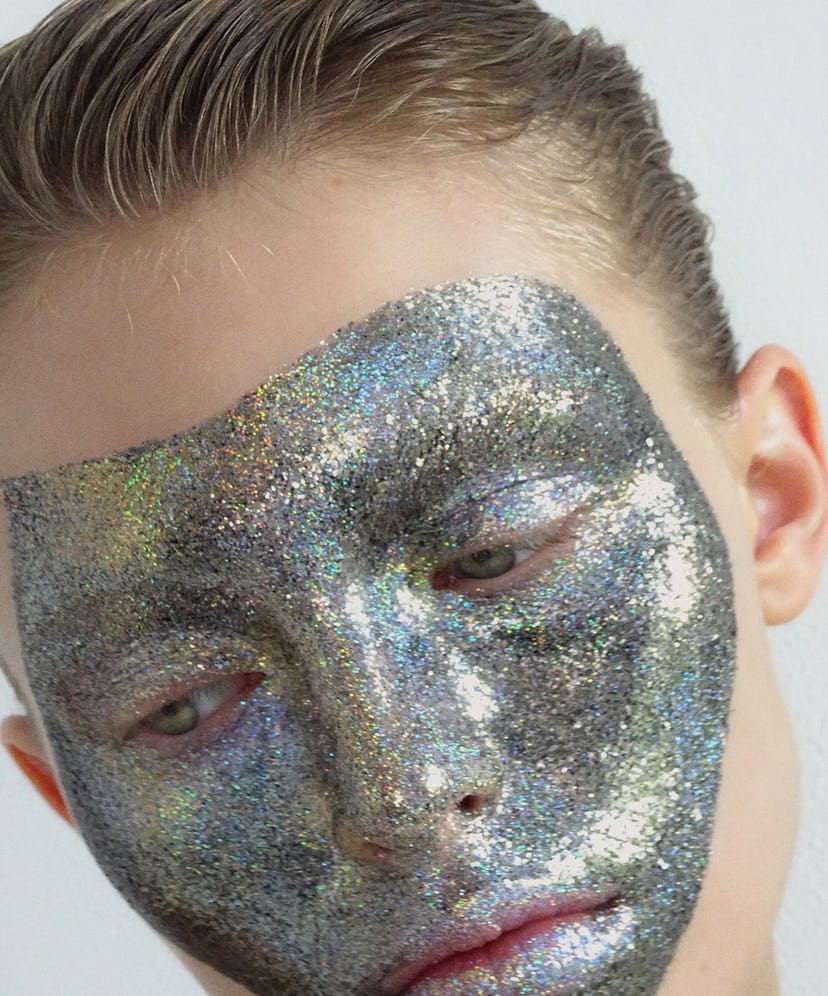 picture of a blonde person with glitter all over their face